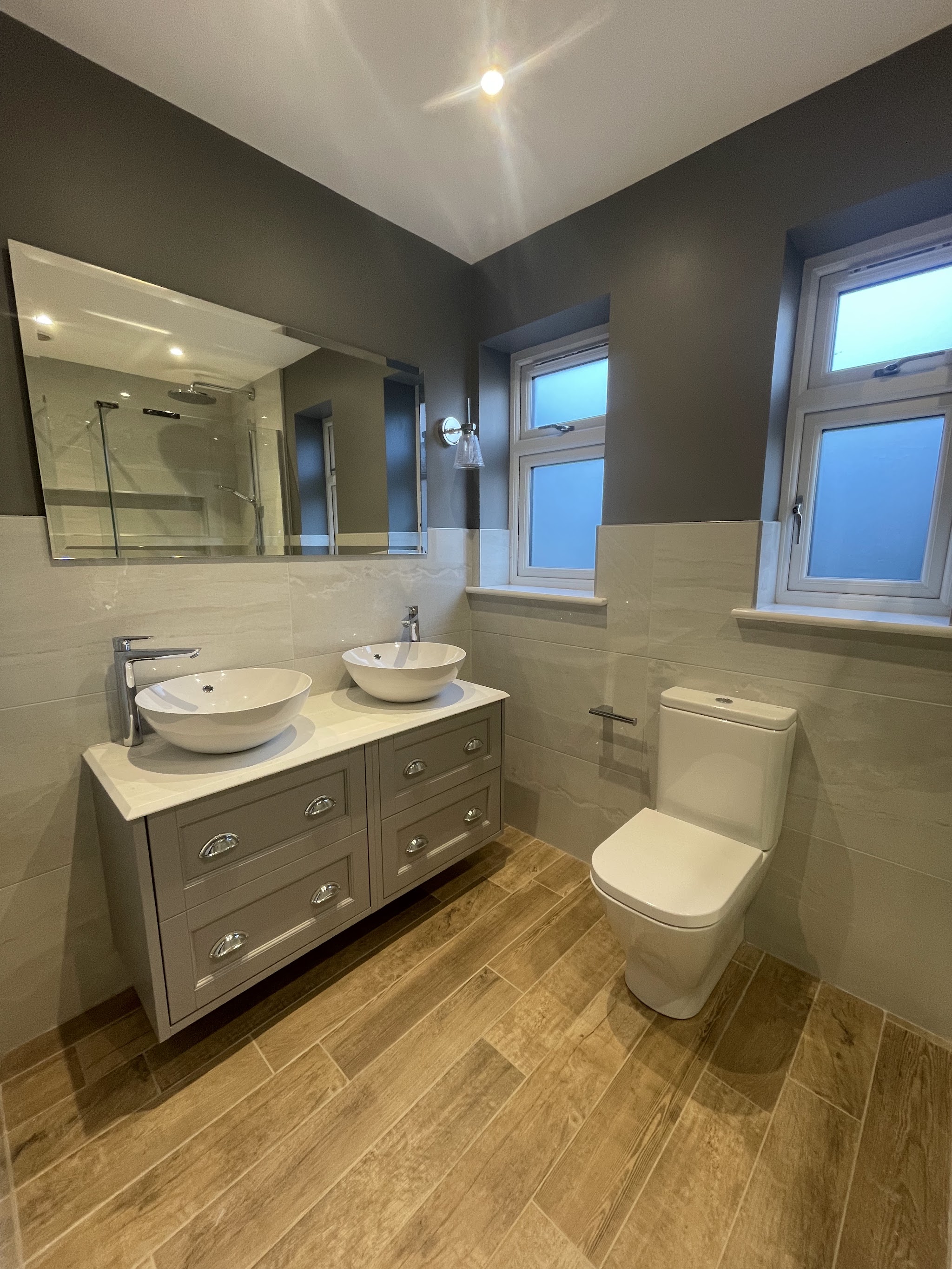 Double vessel basins on a grey vanity unit
