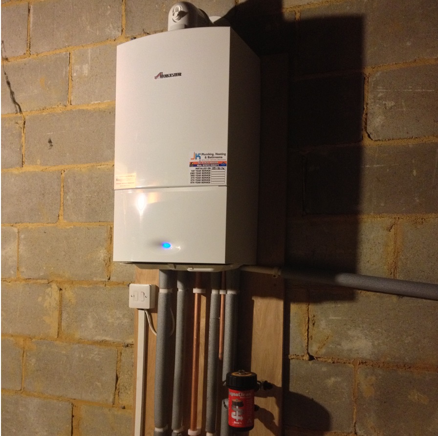 New boiler on a bare block wall