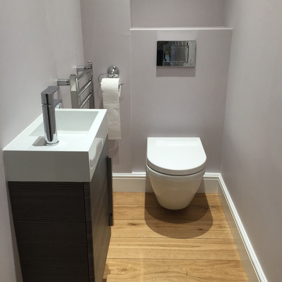 Cloakroom with a wall-hung toilet and vanity