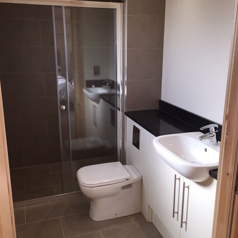 Dark shower room with a vanity unit